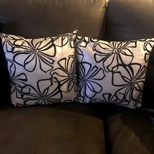 Set of two decorative pillows. Black and white, plain white backs.